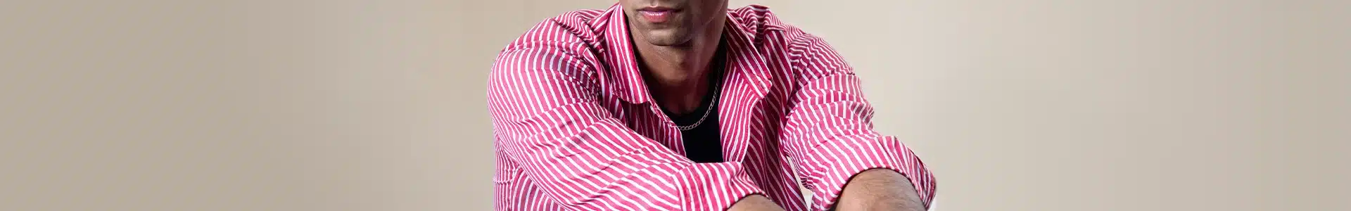 Man wearing a pink striped shirt